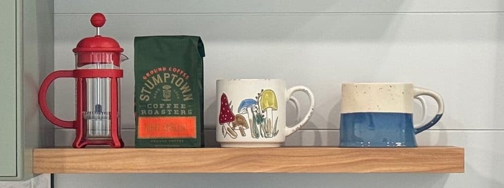 French press and bag of coffee on the kitchen shelf