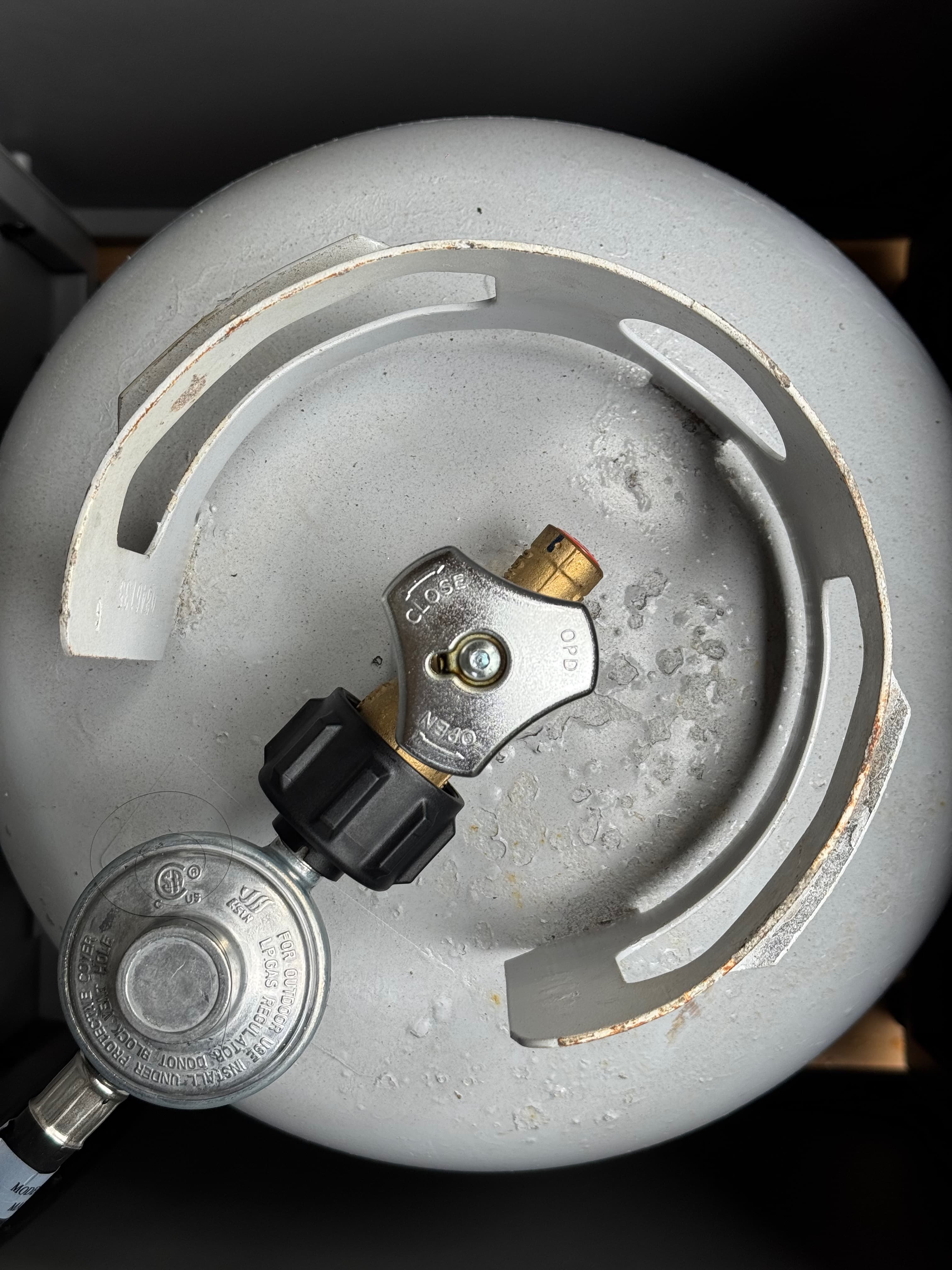 Close-up of the propane tank valve, turned to open