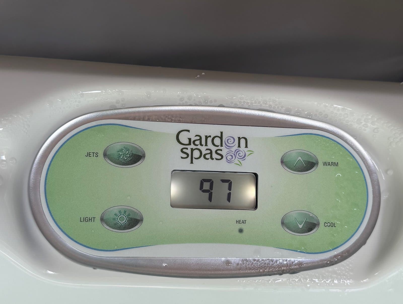 Hot tub digital control panel showing water temperature