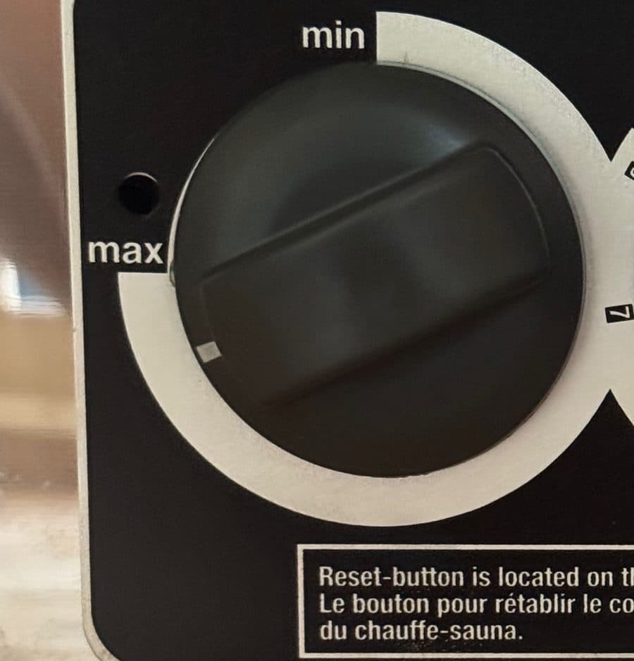 Close-up of the sauna's left-hand temperature dial